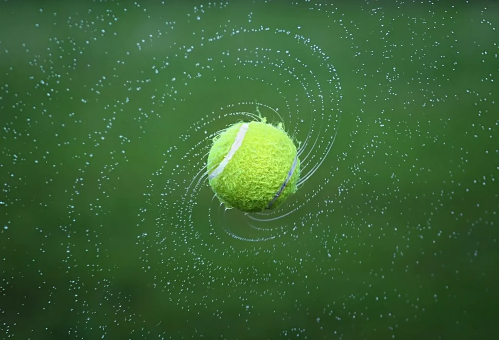 Spinning wet tennis ball